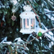 Christmas lantern with candle on branch of snowy winter tree, outdoors Christmas lantern with candle on branch of snowy winter tree, outdoors - PhotoDune Item for Sale