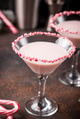 Pink peppermint martini with candy cane rim Pink peppermint martini with candy cane rim - PhotoDune Item for Sale