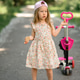 A little girl 3 years old in a pink cap rides a scooter. Summer time. A little girl 3 years old in a pink cap rides a scooter. Summer time. - PhotoDune Item for Sale