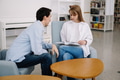 Attractive smiling happy skilled young couple of freelancers sitting at their workplace at home and Attractive smiling happy skilled young couple of freelancers sitting at their workplace at home and - PhotoDune Item for Sale