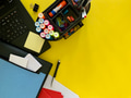 Back to school flat lay with school supplies & laptop on yellow background with copy space Back to school flat lay with school supplies & laptop on yellow background with copy space - PhotoDune Item for Sale