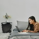 Young Asian woman lying on bed and using laptop. Young Asian woman lying on bed and using laptop. - PhotoDune Item for Sale