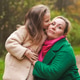 Cuddling mother with daughter in park. Smiling family portrait shows love, affection, support Cuddling mother with daughter in park. Smiling family portrait shows love, affection, support - PhotoDune Item for Sale
