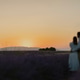 Couple hugging and watching sunset Couple hugging and watching sunset - PhotoDune Item for Sale