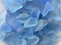 Closeup top view of pastel blue sea glass suitable for a background. Closeup top view of pastel blue sea glass suitable for a background. - PhotoDune Item for Sale