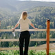 woman from back with bottle of water standing in front of green mountain view, hiking woman from back with bottle of water standing in front of green mountain view, hiking - PhotoDune Item for Sale