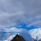 Rustic Wooden Cabin Beneath Towering Snow Mountains Rustic Wooden Cabin Beneath Towering Snow Mountains - PhotoDune Item for Sale