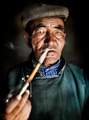 Mongolian Traditional Dress Smoking Pipe Solitude Concept Mongolian Traditional Dress Smoking Pipe Solitude Concept - PhotoDune Item for Sale