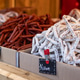Rustic chorizo and nature dried sausages in boxes at Gent Christmas market festival. Rustic chorizo and nature dried sausages in boxes at Gent Christmas market festival. - PhotoDune Item for Sale