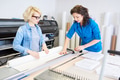 Women Cutting Paper in Printing Shop Women Cutting Paper in Printing Shop - PhotoDune Item for Sale
