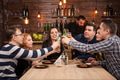 Happy friends group drinking beer and eating pizza at bar restaurant Happy friends group drinking beer and eating pizza at bar restaurant - PhotoDune Item for Sale