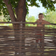 Little boy standing on the fence Little boy standing on the fence - PhotoDune Item for Sale