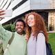 two young women taking a selfie photo with mobile two young women taking a selfie photo with mobile - PhotoDune Item for Sale