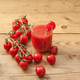 A glass full of tomato juice surrounded by freshly picked tomatoes A glass full of tomato juice surrounded by freshly picked tomatoes - PhotoDune Item for Sale
