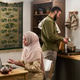 Young Muslim Woman Using Laptop While Young Muslim Man Cooking in Kitchen Young Muslim Woman Using Laptop While Young Muslim Man Cooking in Kitchen - PhotoDune Item for Sale
