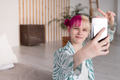 Young woman doing selfie at home Young woman doing selfie at home - PhotoDune Item for Sale