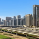 Modern city skyline with public transport infrastructure and skyscrapers under a blue sky Modern city skyline with public transport infrastructure and skyscrapers under a blue sky - PhotoDune Item for Sale