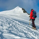 Mountaineer climbs a snowy peak in swiss Alps. Zermatt, Switzerland. Mountaineer climbs a snowy peak in swiss Alps. Zermatt, Switzerland. - PhotoDune Item for Sale
