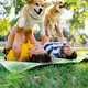 in the park in summer couple lying on the grass holding and hugging a corgi dog like small child in the park in summer couple lying on the grass holding and hugging a corgi dog like small child - PhotoDune Item for Sale