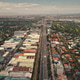 Urban cityscape with streets at traffic roads and green trees at buildings in aerial view. Capital Urban cityscape with streets at traffic roads and green trees at buildings in aerial view. Capital - PhotoDune Item for Sale