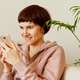 Portrait of mature woman looking social media on mobile phone. Middle-aged female Portrait of mature woman looking social media on mobile phone. Middle-aged female - PhotoDune Item for Sale