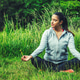 Young Woman Sitting On Green Grass Practicing Mindfulness Meditation In High Grass Field Young Woman Sitting On Green Grass Practicing Mindfulness Meditation In High Grass Field - PhotoDune Item for Sale