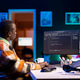 Black software engineer writes complex binary code scripts on computer Black software engineer writes complex binary code scripts on computer - PhotoDune Item for Sale