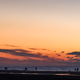 walking people at the beach during an impressive sunset sky walking people at the beach during an impressive sunset sky - PhotoDune Item for Sale
