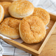 Freshly baked lush burger buns lie on a wooden tray on a table with a white napkin. Freshly baked lush burger buns lie on a wooden tray on a table with a white napkin. - PhotoDune Item for Sale