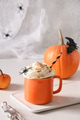 Halloween pumpkin latte coffee with whipped cream decorated spiders Halloween pumpkin latte coffee with whipped cream decorated spiders - PhotoDune Item for Sale