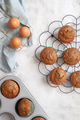 Carrot cake muffins on a cooling rack on white background, with muffin tin and fresh eggs Carrot cake muffins on a cooling rack on white background, with muffin tin and fresh eggs - PhotoDune Item for Sale