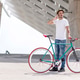 young man using his cellphone while going to work with his bicycle young man using his cellphone while going to work with his bicycle - PhotoDune Item for Sale