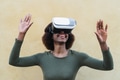 Afro woman using virtual reality glasses outdoor Afro woman using virtual reality glasses outdoor - PhotoDune Item for Sale