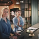 Businesswomen talking with coworkers during an office meeting Businesswomen talking with coworkers during an office meeting - PhotoDune Item for Sale