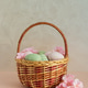 Wicker Easter Basket with Pastel Eggs and Flowers. Soft Spring Decor Wicker Easter Basket with Pastel Eggs and Flowers. Soft Spring Decor - PhotoDune Item for Sale