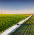 Road and car on the field. Wind power station. Landscape from the air. Road and car on the field. Wind power station. Landscape from the air. - PhotoDune Item for Sale