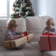 cute kids in Christmas pajamas with gift boxes at christmas morning cute kids in Christmas pajamas with gift boxes at christmas morning - PhotoDune Item for Sale