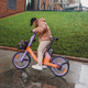 Riding rented electric bicycle during rainy commute. Ebike rental sharing supports urban transport Riding rented electric bicycle during rainy commute. Ebike rental sharing supports urban transport - PhotoDune Item for Sale
