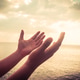 A man praying hand for blessings When the sun goes down Hope for a happy life A man praying hand for blessings When the sun goes down Hope for a happy life - PhotoDune Item for Sale