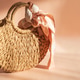 Woven Straw Handbag with Silky Scarf. Elegant Summer Fashion Flatlay on Peach Background Woven Straw Handbag with Silky Scarf. Elegant Summer Fashion Flatlay on Peach Background - PhotoDune Item for Sale