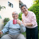 Elderly couple enjoys time in garden while sharing a warm drink on a sunny afternoon Elderly couple enjoys time in garden while sharing a warm drink on a sunny afternoon - PhotoDune Item for Sale