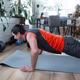 Man does push-ups on mat, fitness at home, athletic top, healthy daily routine Man does push-ups on mat, fitness at home, athletic top, healthy daily routine - PhotoDune Item for Sale