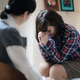 A desperate woman with mental disorder at a session with a therapist A desperate woman with mental disorder at a session with a therapist - PhotoDune Item for Sale