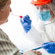 Physician wearing personal protective equipment performing a Coronavirus COVID-19 PCR test Physician wearing personal protective equipment performing a Coronavirus COVID-19 PCR test - PhotoDune Item for Sale