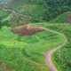 Aerial view from drone of rural village and mountain road Aerial view from drone of rural village and mountain road - PhotoDune Item for Sale