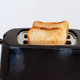 Slice of bread popping up from toaster, heating and toasting breakfast food, morning routine. Slice of bread popping up from toaster, heating and toasting breakfast food, morning routine. - PhotoDune Item for Sale