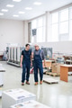 Printing house workers talking in workshop Printing house workers talking in workshop - PhotoDune Item for Sale