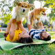 in the park in summer couple lying on the grass holding and hugging a corgi dog like small child in the park in summer couple lying on the grass holding and hugging a corgi dog like small child - PhotoDune Item for Sale