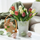 Easter Bunny Basket with Decorated Eggs and Tulip Bouquet. Cozy Spring Arrangement Easter Bunny Basket with Decorated Eggs and Tulip Bouquet. Cozy Spring Arrangement - PhotoDune Item for Sale
