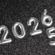 Silver 2026 Numbers on Sparkling Black Glitter Background New Year Celebration Concept Silver 2026 Numbers on Sparkling Black Glitter Background New Year Celebration Concept - PhotoDune Item for Sale